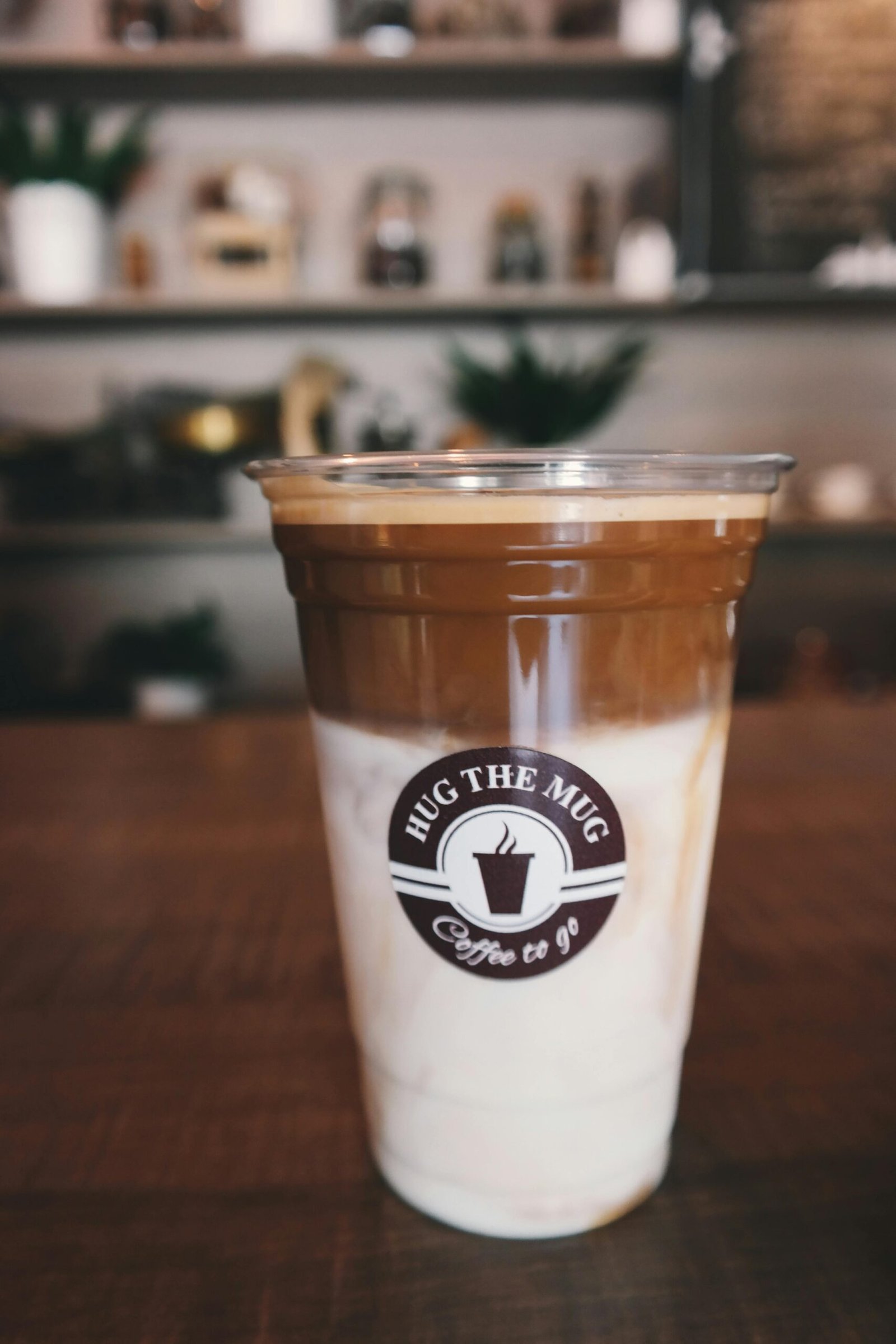 Close-up of a delicious iced latte in a coffee shop, perfect for morning caffeine boost.